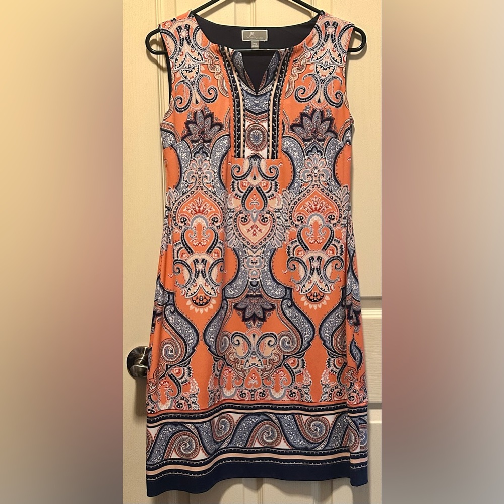 Beautiful multi color dress with silver accents and navy trim.